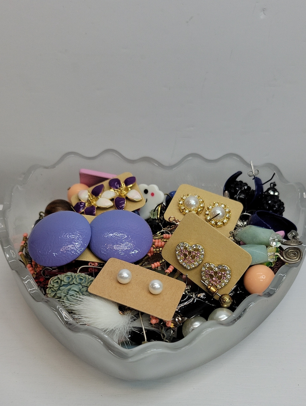 Glass Heart Dish Filled With Earrings